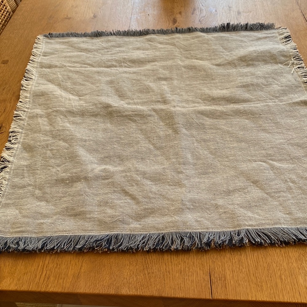 24 square pillow w/fringe. Faded chambray blue on one side Light sand on other.